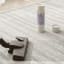 Sanic Mattress & Upholstery Field Fresh Powder, 400g on the rug with a vacuum cleaner