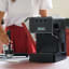 Gaggia Evolution Espresso Coffee Machine - Black on the kitchen counter with a Portafilter