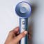 Laifen Swift High Speed Hair Dryer, 1600W - Silver Blue handheld showing scale