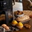Kenwood Digital Airfryer with Grill Function and Clearcook Window, 6L on the kitchen counter with baked muffins