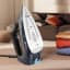 Braun TexStyle 9 Steam Iron with iCare, 3200W next to clothes