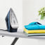 Braun TexStyle 7 Steam Iron, 3000W next to clothes