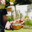 Ngwenya Glass Organic Highball Tumblers, Set of 4 with a bottle of beer