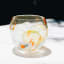 Ngwenya Glass Flecked Organic Short Indented Tumblers, Set of 4 - Orange on the table