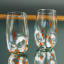 Ngwenya Glass Flecked Organic Highball Tumblers, Set of 4 - Orange on the table