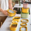 Guzzini Eco Store & More Deep Container, 750ml - Mango Yellow on the kitchen counter