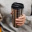 Nespresso Stainless Steel Touch Travel Mug, 345ml handheld showing scale