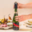 Dreamfarm Champagne Popper Cork Catcher on a champagne bottle