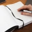 The Papery Classic Multi-Planner - Black on the table