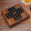 Suck UK Iron & Glory Wooden Solitaire Set on the table