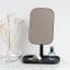 Brabantia ReNew Mirror with Storage Tray - Dark Grey with a bottle of perfume