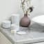 Brabantia ReNew Storage Pots, Set of 3 - White next to the basin