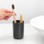 Brabantia ReNew Toothbrush Holder - Dark Grey next to a basin