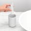 Brabantia ReNew Toothbrush Holder - White next to a basin