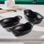 Le Creuset Gourmet Matte Black Collection Cast Iron Mini Oval Bakers, Set of 4 on the kitchen counter
