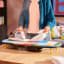 Joseph Joseph Pocket Folding Jonathan Lawes Ironing Board on the table