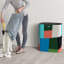 Joseph Joseph Tota Laundry Separation Basket, 90L against the wall