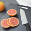 MicroGarden Black Wood Fibre Chopping Board - 30cm with sliced grapefruit