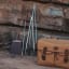 Donkey Long Tong Stainless Steel Braai Tongs, 69cm against a rock