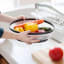 Creative Cooking Microwave Food Cover under running water with veggies