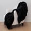 Linen House Arctic Snug Fur Throw, 150cm x 200cm - Midnight on a chair