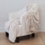 Linen House Arctic Snug Fur Throw, 150cm x 200cm - Ivory on a chair