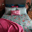 India Ink Jade Garden of Eden Kantha Stitched Throw - Double on the bed