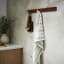 Ulster Weavers Sage Stripe Cotton Tea Towel on a hanger