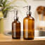&Again Amber Glass Pump Bottle - 250ml in the bathroom