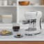 Smeg Retro Manual Espresso Coffee Machine - Ice White on the kitchen counter