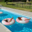 Sunnylife Luxe Tube Pool Ring - Stole My Heart Pink Stripe in the pool