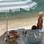 Sunnylife Compact Beach Umbrella - La Palma Sage Stripe at the beach