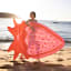Sunnylife Luxe Lie-On Float - Strawberry Pink at the beach