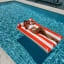 Sunnylife Luxe Lilo Float - Red Stripe in a pool