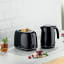 Kenwood Eterna 2-Slice Toaster, 930W - Black with a kettle on the kitchen counter