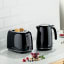 Kenwood Eterna Cordless Electric Kettle, 1.7L - Black with a toaster on the kitchen counter