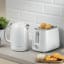Kenwood Elementa Stainless Steel Cordless Electric Kettle, 1.7L - White with a toaster on the kitchen counter