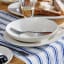 Mikasa Navy Striped Table Runner, 230cm on the table with a dinner set