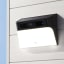 Eufy 2K Solar Wall-Light & Camera on a wall