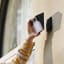 Eufy 2K Solar Wall-Light & Camera mounting on a wall