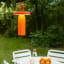Arc & Hue Ella Portable & Rechargeable LED Outdoor Lamp - Orange hung on a tree branch