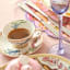 Maxwell & Williams Estelle Michaelides Mystique Espresso Cup & Saucers, Set of 4 with tea on the table