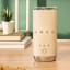 Smeg Electric Milk Frother, 180ml - Vintage Cream on the table