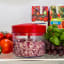 KitchenAid Hand Pull Food Chopper with chopped red onion