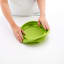 Lekue Silicone Collapsible Colander, 23cm - Green pressed on the kitchen counter