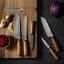 Wolstead Satoru Damascus Utility Knife, 12.5cm with other knives on chopping board