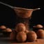 NOMU Cocoa Powder - 250g sprinkled on chocolate balls