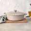 Le Creuset Brioche Signature 6.3 Litre Oval Cast Iron Casserole, 31cm on the table