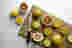 Utility knife on a chopping board with citrus