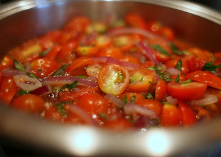 Cooking tomatoes and onion
